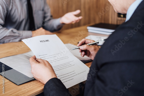 Business man explaining about his profile to two senior manager sitting in during job Interview, interview the job and hiring