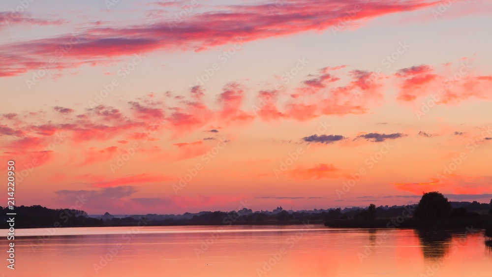dramatic sunset with red sky and clouds, reflections on still water, warm summer countryside dusk panorama background photo dramatic sunset with red sky and clouds, reflections on still water, warm summer countryside dusk panorama background photo