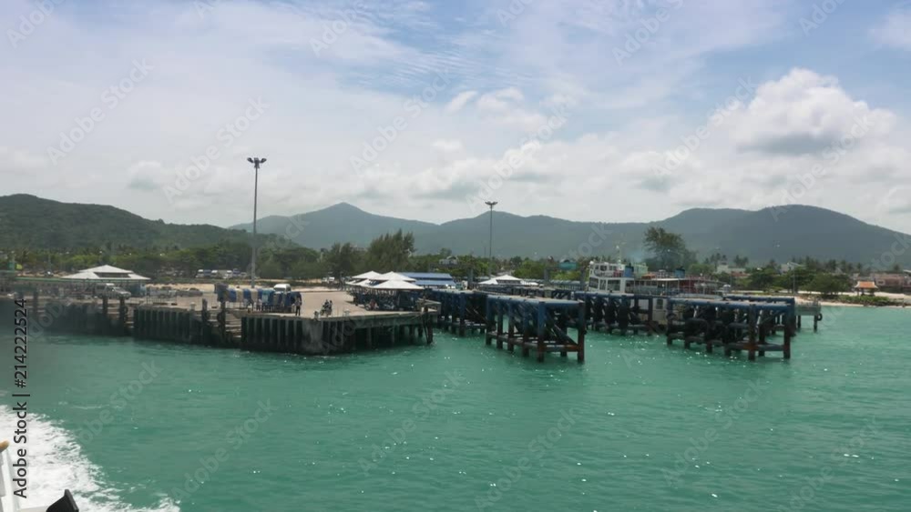 View of Koh Phangan harbour from port quarter of passenger ferry as it leaves towards Koh Samui in Thailand View of Koh Phangan harbour from port quarter of passenger ferry as it leaves towards Koh Samui in Thailand