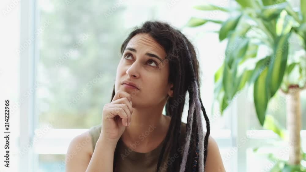 Beautiful Woman With Dreadlocks, Thinking, Wondering, Indoor Beautiful Woman With Dreadlocks, Thinking, Wondering, Indoor
