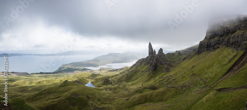 A path to the Old Man of Storr on the Isle of Skye with a sea in the background during a cloudy summer day in Scotland