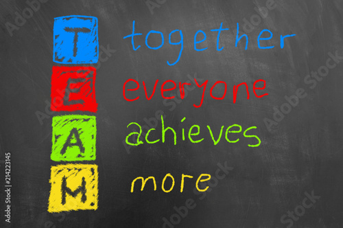 Together everyone achieves more colorful team text on chalkboard.
