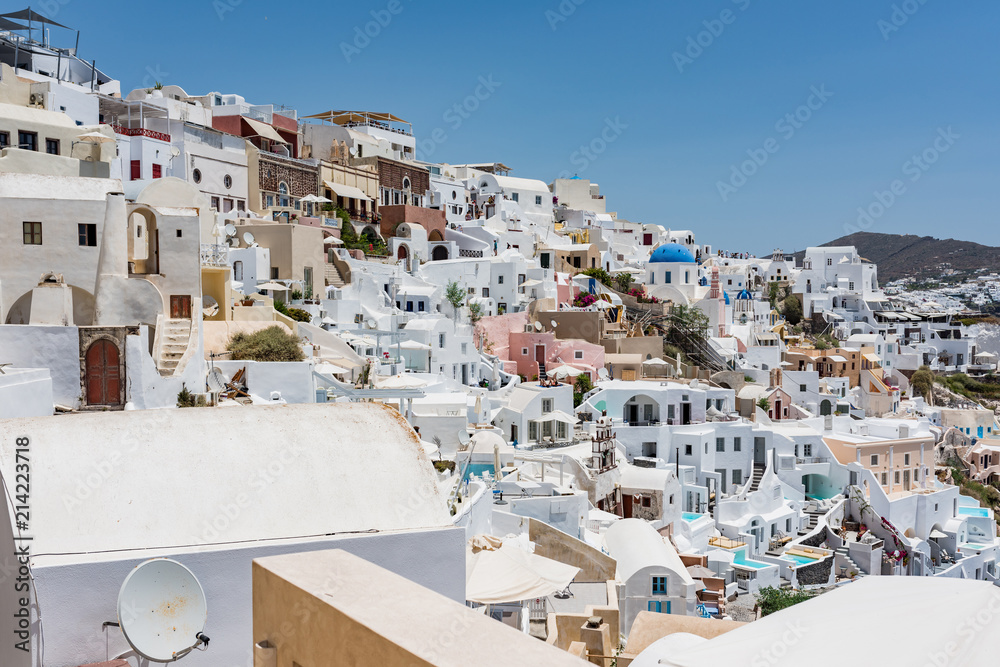 Tiny little white houses, hotels and small churches in the Oia village at Santorini, Greece. Tiny little white houses, hotels and small churches in the Oia village at Santorini, Greece.