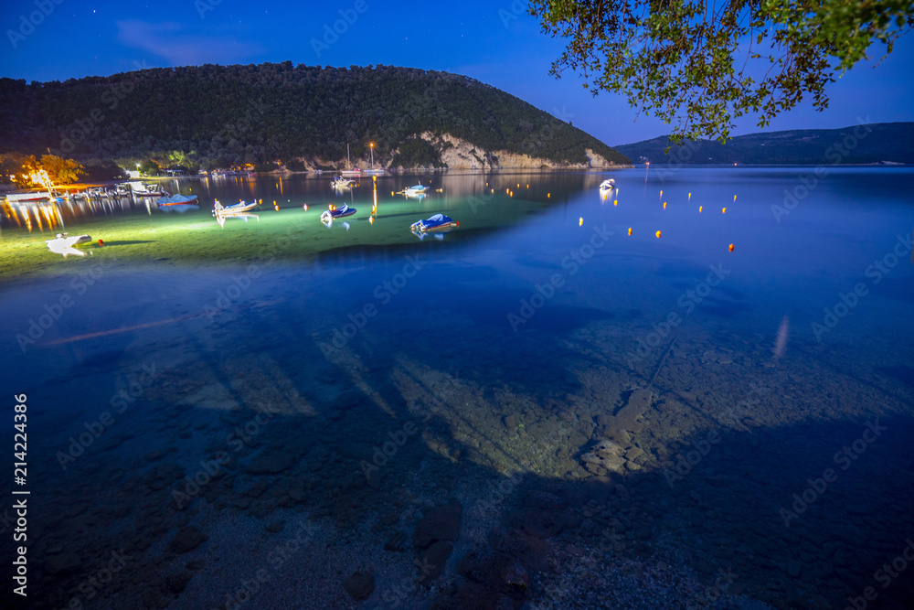 Fototapeta premium Desimi Beach Golf and nearby Island with clear water in Greece