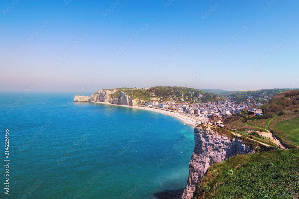 Picturesque landscape of Etretat in sunny spring day. View from the mountain to the city and the streets of Etretat and the English Channel. Etretat, Seine-Maritime department, Normandy, France