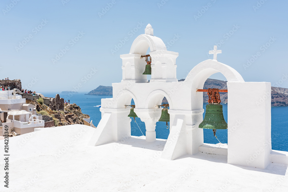 Green bells on roof of the church in the Oia village at Santorini, Greece. Green bells on roof of the church in the Oia village at Santorini, Greece.