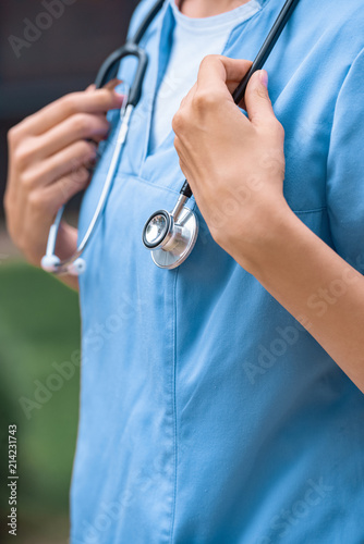 cropped image of medical student touching stethoscope on neck © LIGHTFIELD STUDIOS