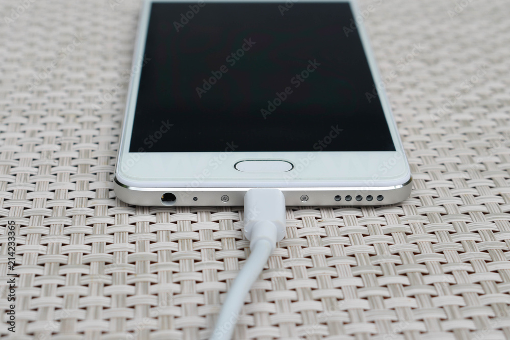Charging smartphone. Close up Charging smartphone. Close up