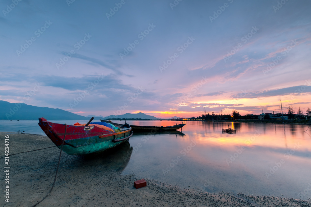 Sunset on Lap An lagoon and Lang Co Bay with colorful layers of cloud and . Lang Co Bay is one of the famous and beautiful bays of the world. HUE - VIET NAM