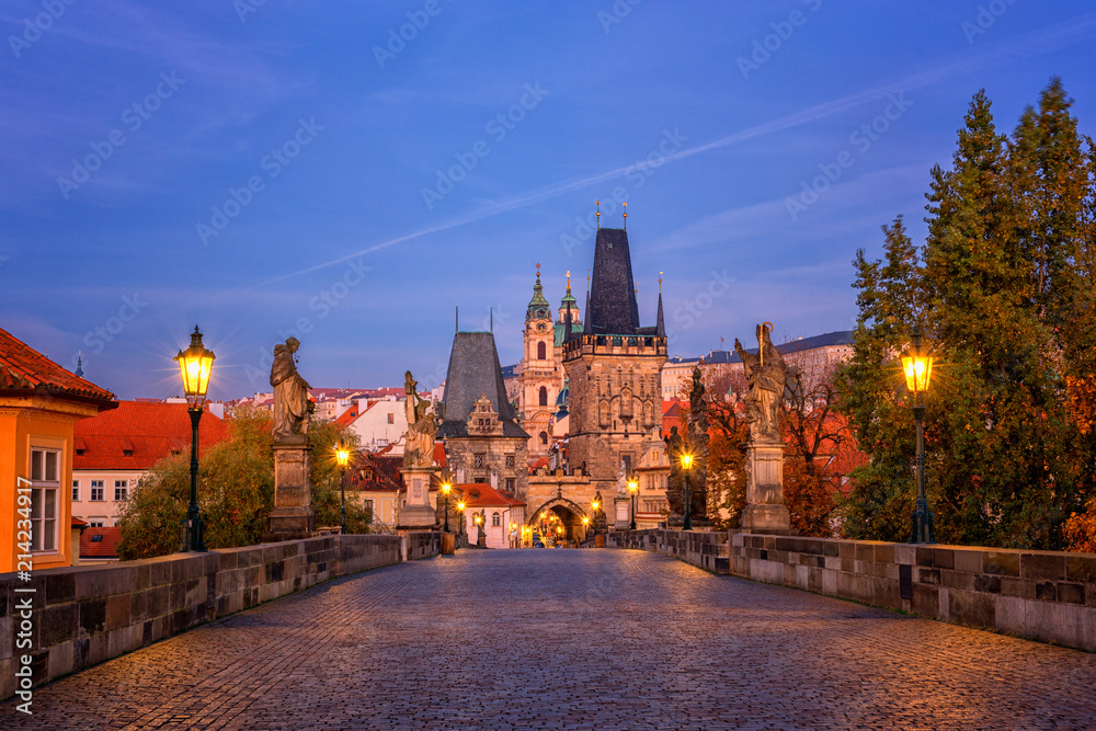 Charles bridge (Karluv most) at dawn before sunrise, scenic view of the Lesser, Prague, Czech Republic