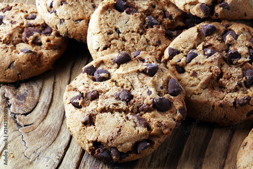 Chocolate cookies on table. Chocolate chip cookies shot with chocolate Chocolate cookies on table. Chocolate chip cookies shot with chocolate