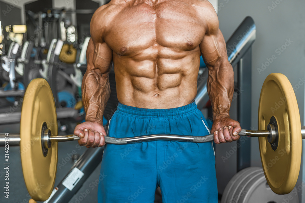 Brutal aged strong bodybuilder athletic men pumping up muscles with dumbbells Brutal aged strong bodybuilder athletic men pumping up muscles with dumbbells