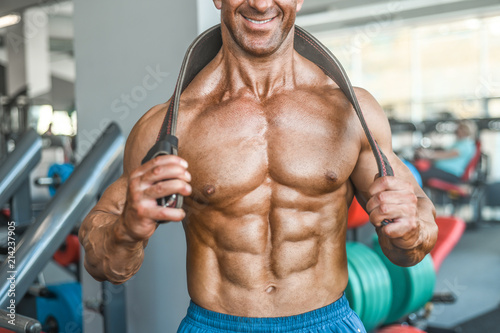 Brutal aged strong bodybuilder athletic men pumping up muscles with dumbbells