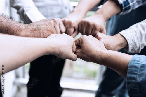 People hand assemble as a connection meeting teamwork concept. Group of people colleague assembly hands as a business or work achievement. Man and women touch each other hands. Teamwork conceptual.