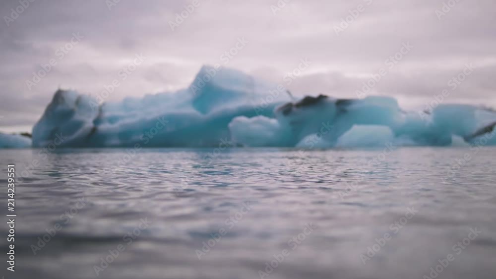 Blue icebergs at Jokulsarlon Ice Lagoon and seagulls over, Iceland, background Blue icebergs at Jokulsarlon Ice Lagoon and seagulls over, Iceland, background
