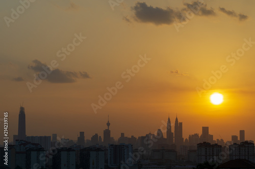 Majestic sunset over KL Tower and surrounded buildings in downtown Kuala Lumpur, Malaysia.