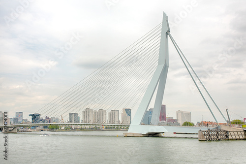 Urban skyline of modern and innovative Rotterdam popping against a white sky.