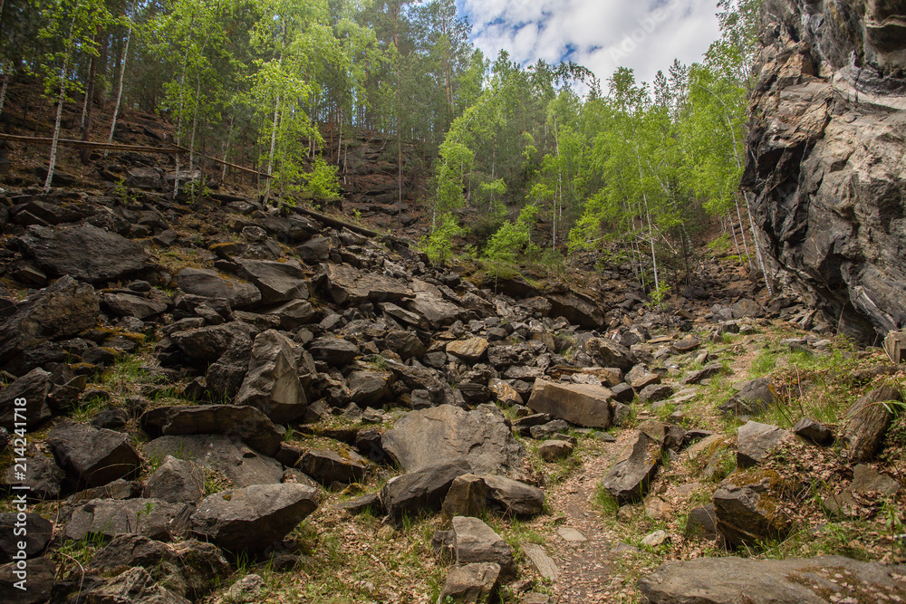 Abandoned ore mica mine quarry open pit in forest Abandoned ore mica mine quarry open pit in forest