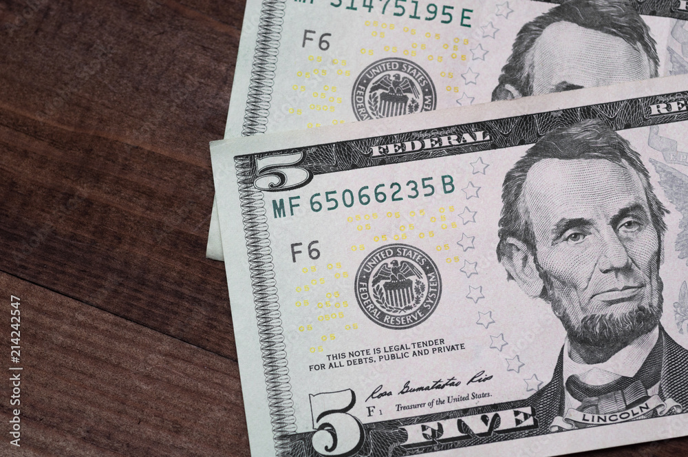 Close up of different dollar bills.. Concept of money and earnings. Money savings. Close up of different dollar bills.. Concept of money and earnings. Money savings.