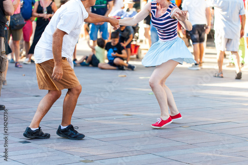 Group of people dancing swing outdoors © oriol
