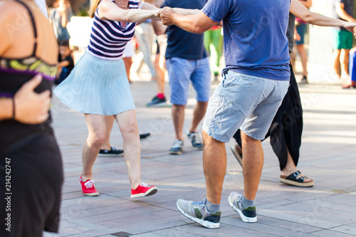 Group of people dancing swing outdoors