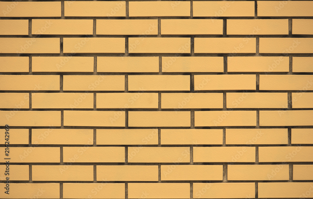 Yellow Stone brick wall texture for background.