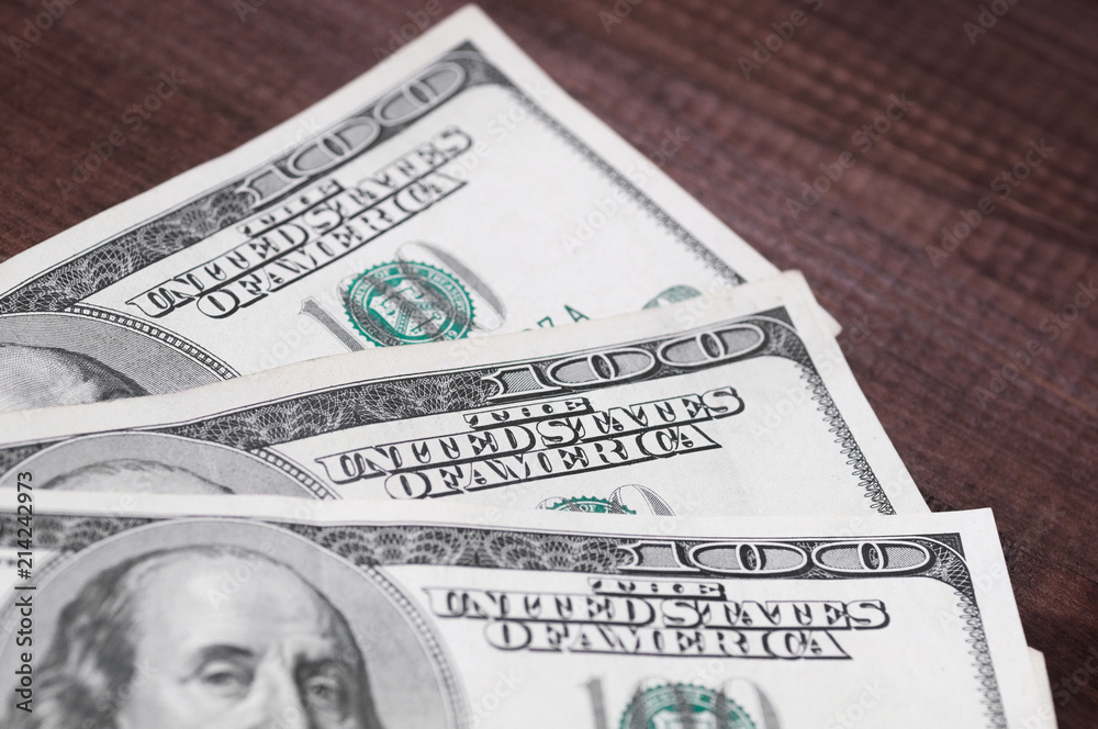 Dollars closeup. Benjamin Franklin's portrait on a bill.Concept of money and earnings. Dollars closeup. Benjamin Franklin's portrait on a bill.Concept of money and earnings.