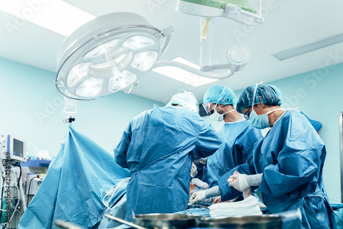 Team of Surgeons Operating