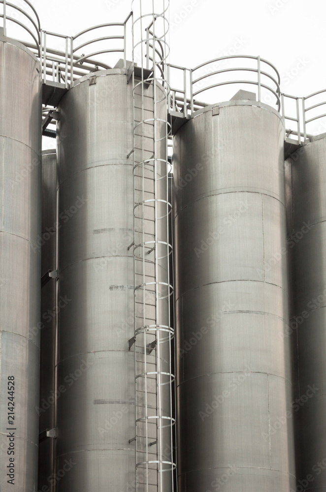 Metal tower silos of the industrial plant Metal tower silos of the industrial plant