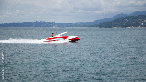 Boat sailing on the sea against the background of mountains 