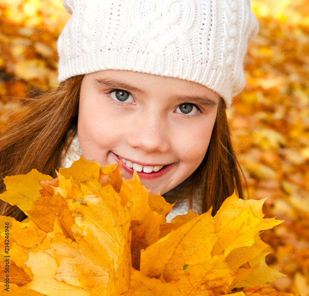 Autumn portrait of adorable smiling little girl child with leaves Autumn portrait of adorable smiling little girl child with leaves