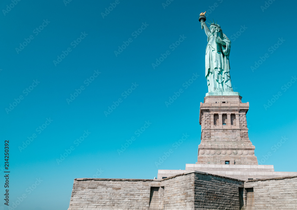 Statue of Liberty complete structure with clear blue sky above