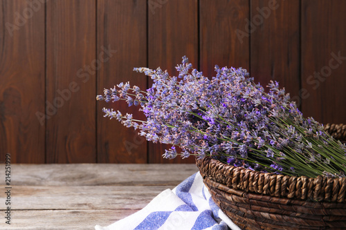 Fototapeta Naklejka Na Ścianę i Meble -  Bowl with lavender flowers on wooden table