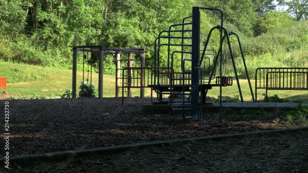 Empty kids playground with a woodland background. Empty kids playground with a woodland background.