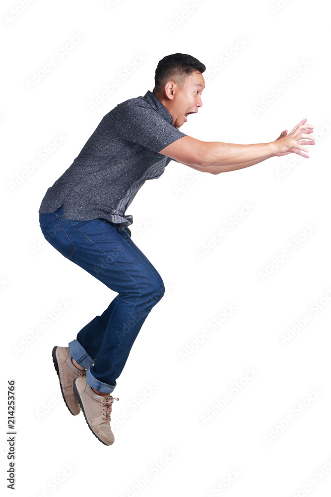 Young Man Reach Something at His Front. Side View Young Man Reach Something at His Front. Side View