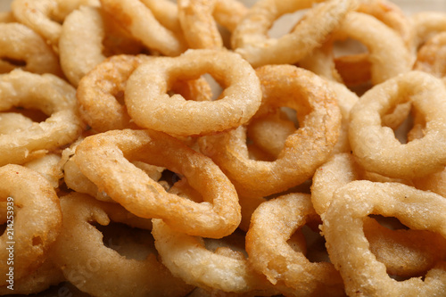 Freshly cooked onion rings as background © New Africa