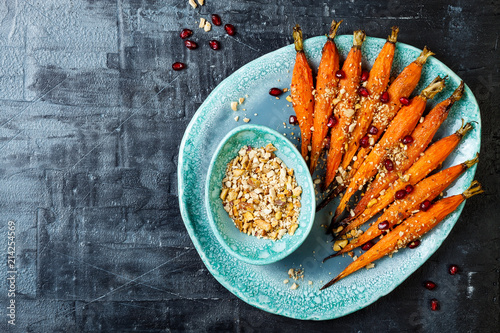 Roasted carrots with dukkah. Vegetarian food. Top view, flat lay, copy space photo