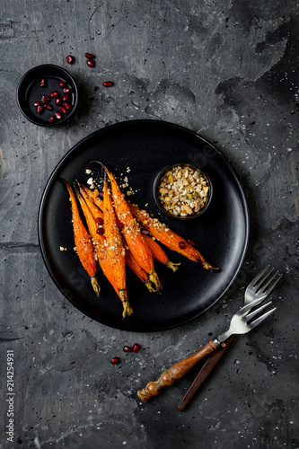 Roasted carrots with dukkah. Vegetarian food. Top view, flat lay