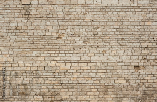 Brick wall texture for design. Part of the wall of the ancient castle as a texture.