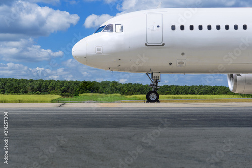 White jet airplane on runway 