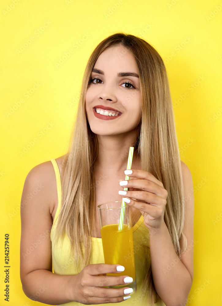 Young smiling woman holding glass withu juice Young smiling woman holding glass withu juice