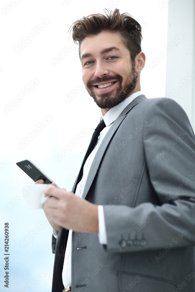 Stylish man in suit is reading information on phone Stylish man in suit is reading information on phone