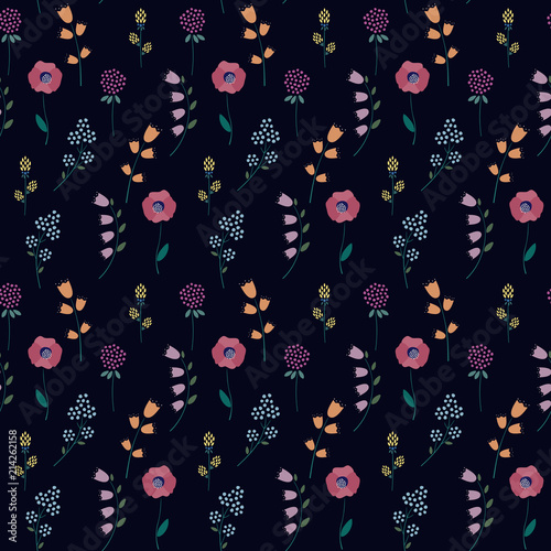 Floral pattern on dark background. Cute tiny flowers seamless background - campanula, clover, poppies. Beautiful flowers texture. Design for fabric, wallpaper, textile and decor. photo