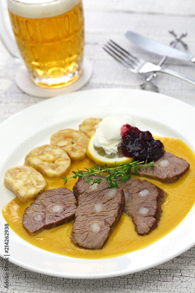 svickova na smetane ( beef in sour cream sauce) served with knedlik (bread dumpling), traditional Czech cuisine