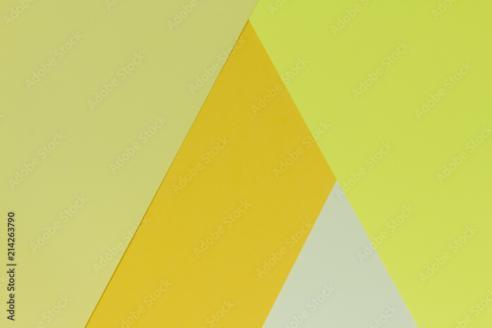 Creative geometric paper background. Pattern of similar (monochrome) shades of yellow. Abstraction. Flat lay. Creative geometric paper background. Pattern of similar (monochrome) shades of yellow. Abstraction. Flat lay.