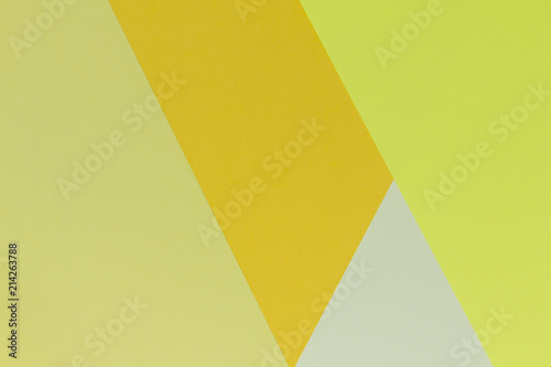 Creative geometric paper background. Pattern of similar (monochrome) shades of yellow. Abstraction. Flat lay.