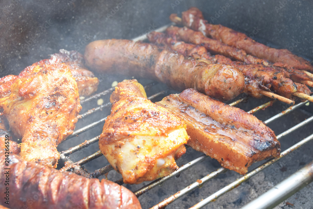 roast chicken and sausages on the grill roast chicken and sausages on the grill