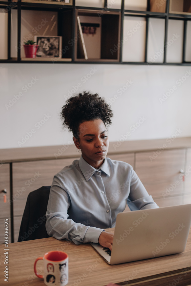 Woman working on laptop Woman working on laptop