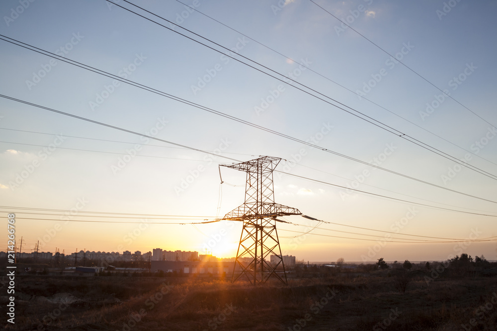 Electricity pylon against the sunset