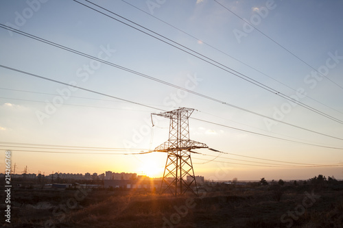 Electricity pylon against the sunset